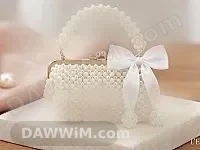 حقيبة يدوية مزينة بالخرز واللؤلؤ