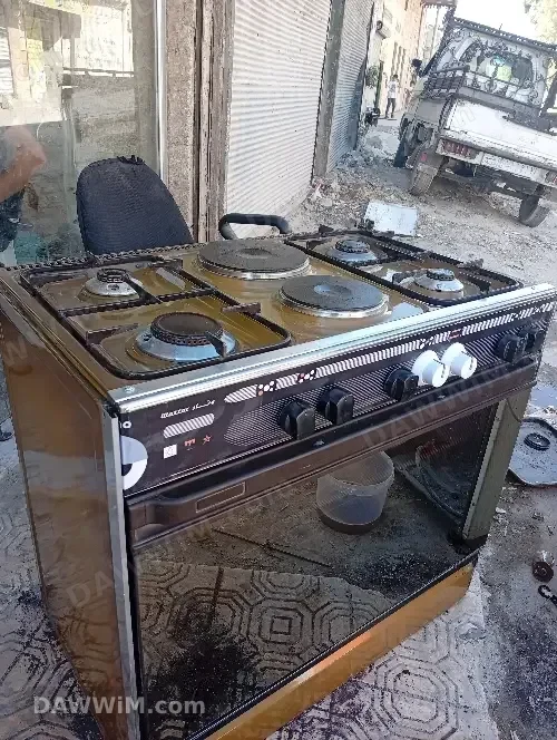 غرن غاز أربع روس مع فرن